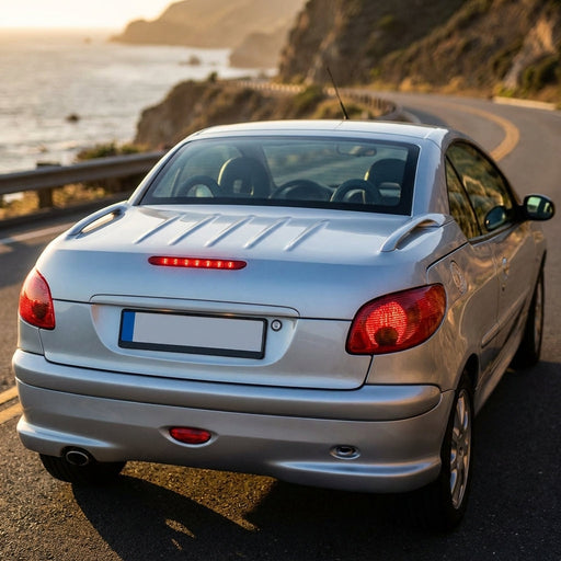 Full-body view of Peugeot 206cc with integrated red third brake light on trunk during golden hour outdoor setting.