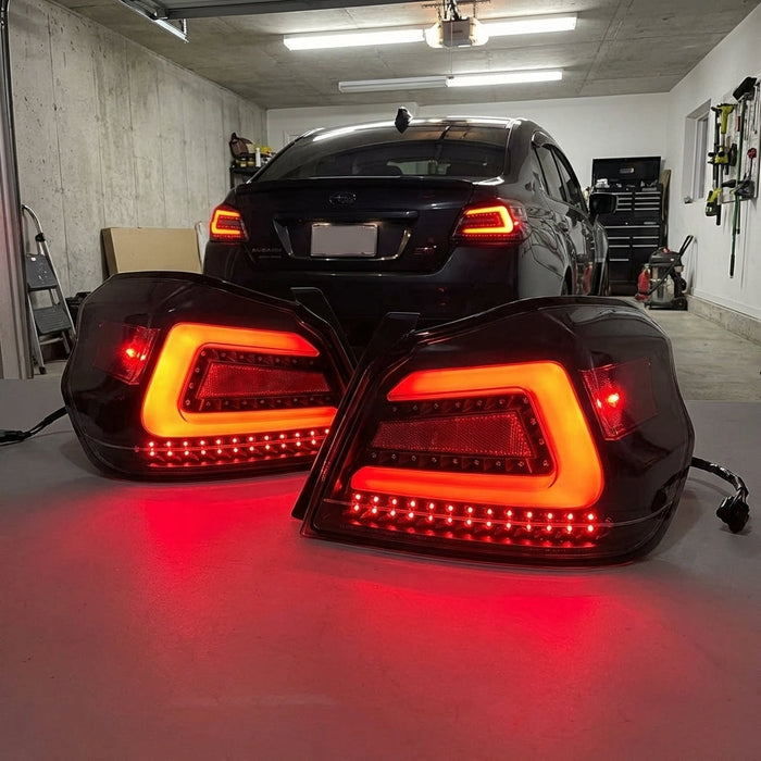 Interior view of Subaru WRX STI VA’s rear with illuminated tail lights, showcasing lens clarity, LED details, and seamless wiring in a garage setting.